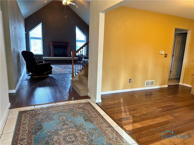 interior space featuring hardwood / wood-style flooring and vaulted ceiling