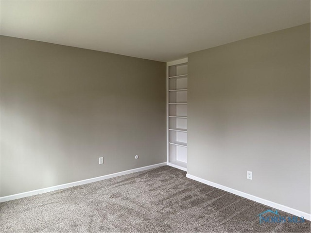 unfurnished room featuring carpet flooring