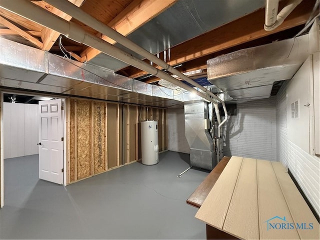 basement featuring heating unit and water heater