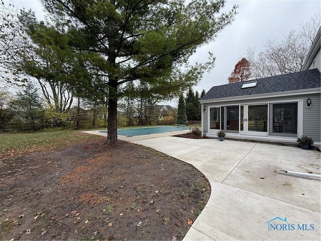 view of yard with a patio area and a covered pool