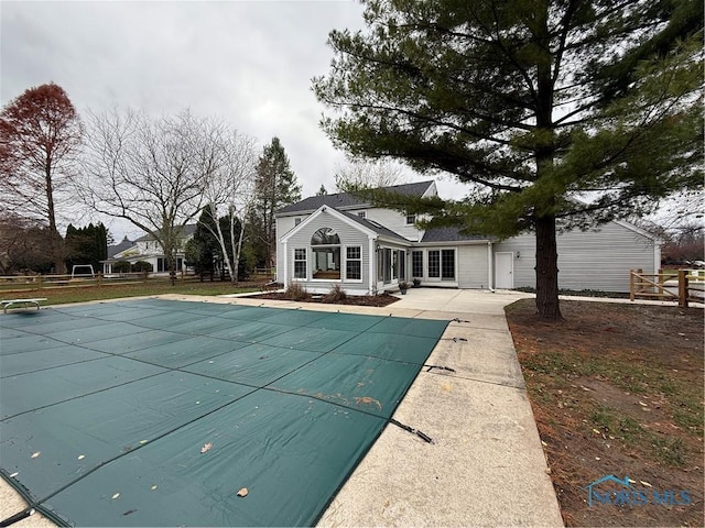 view of swimming pool with a patio