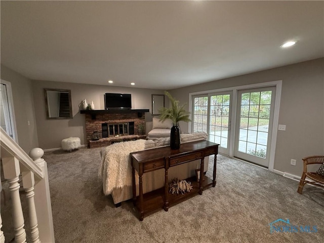 living room with carpet and a fireplace