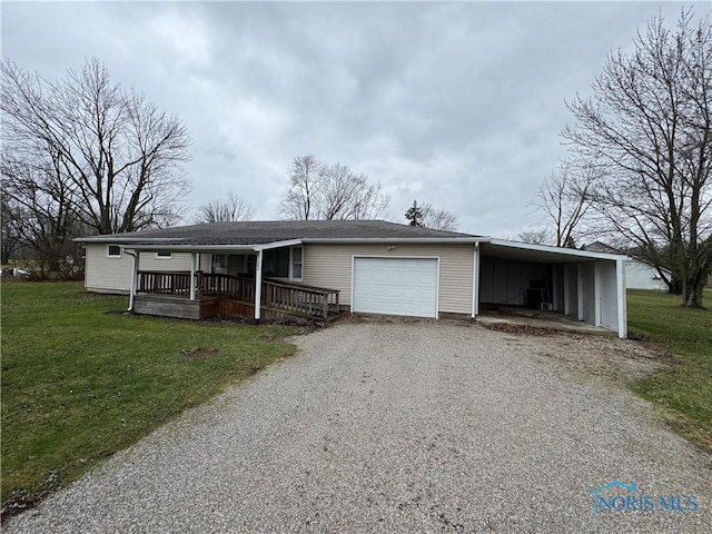 view of front of home with a front yard, a porch, and a garage