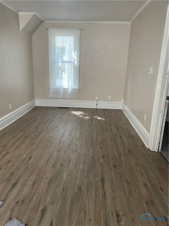 bonus room with dark wood-type flooring