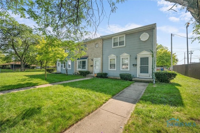 view of front of home with a front lawn