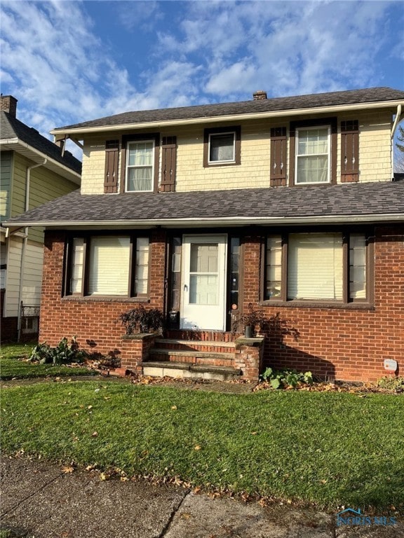 view of front of home with a front yard