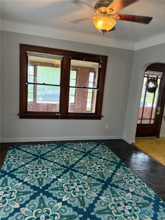 4127 Burnham Ave, Toledo, OH 43612 - unfurnished room featuring arched walkways, wood finished floors, baseboards, and ceiling fan