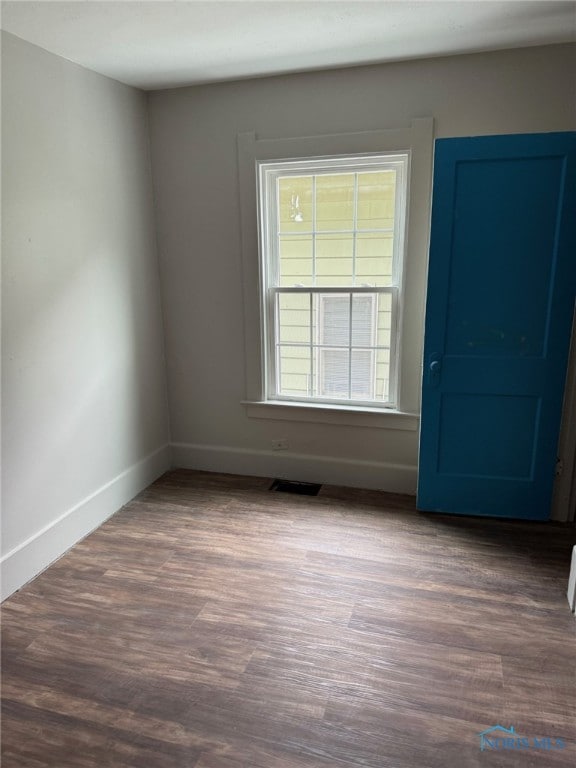 4127 Burnham Ave, Toledo, OH 43612 - empty room featuring baseboards and wood finished floors