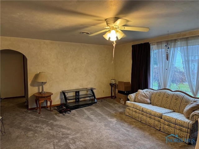 living room with carpet floors and ceiling fan