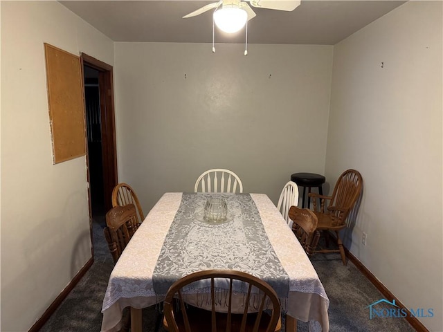 carpeted dining room with ceiling fan