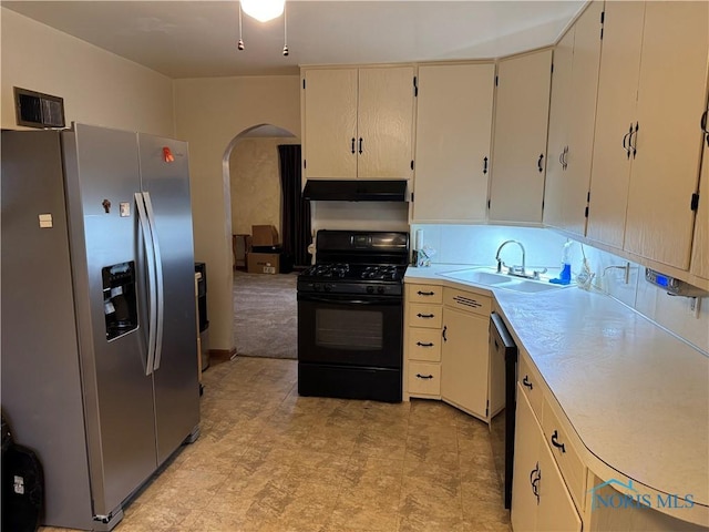 kitchen with black appliances, sink, and cream cabinets