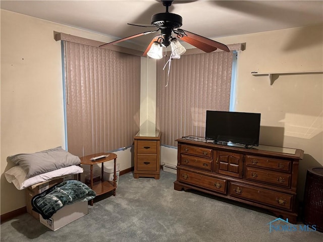 living area with ceiling fan and light colored carpet