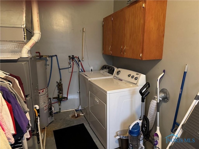 laundry area with cabinets and separate washer and dryer