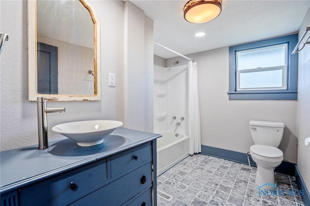 full bathroom with toilet, tile patterned floors, vanity, and shower / tub combo with curtain