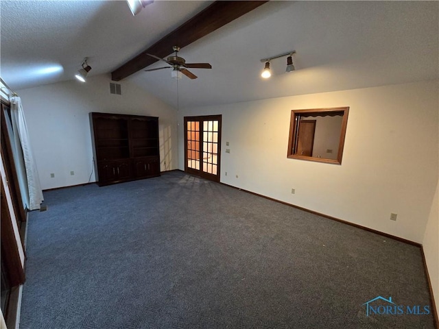 carpeted empty room with french doors, vaulted ceiling with beams, and ceiling fan