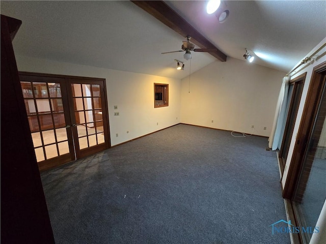 carpeted empty room featuring lofted ceiling with beams, ceiling fan, and french doors