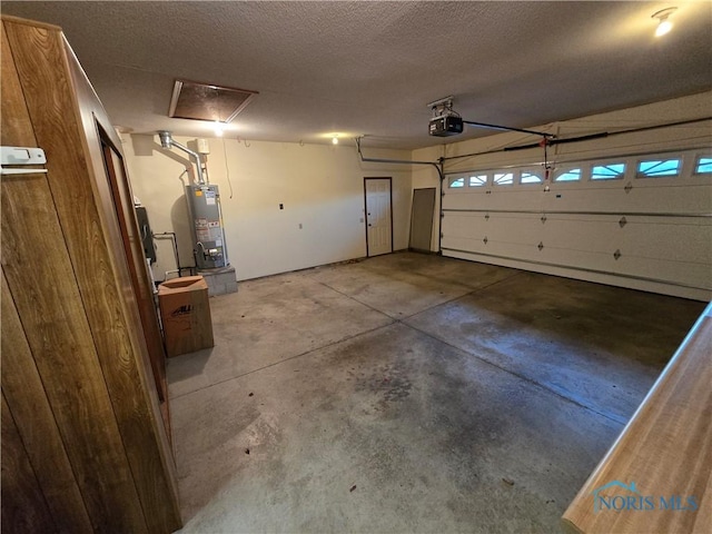 garage with water heater and a garage door opener