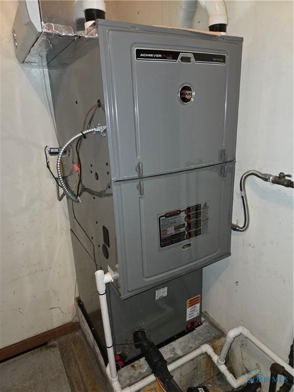 utility room with heating unit