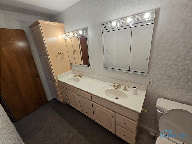 bathroom featuring vanity and toilet