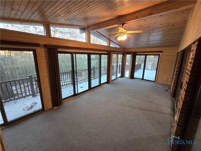 unfurnished sunroom featuring vaulted ceiling with beams, ceiling fan, and wooden ceiling