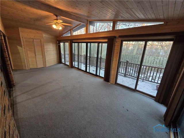 interior space with carpet flooring, vaulted ceiling with beams, and wood ceiling