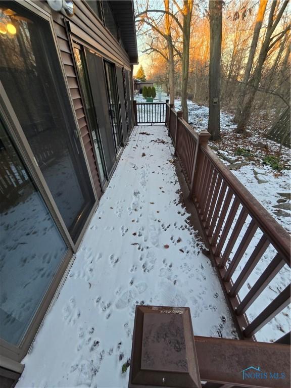 view of snow covered deck