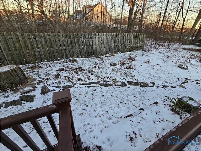 view of yard layered in snow