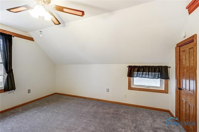 additional living space with ceiling fan, lofted ceiling, and carpet floors