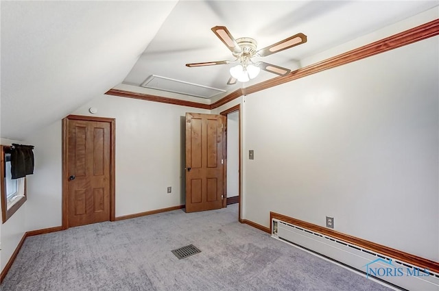 additional living space featuring light carpet, lofted ceiling, ceiling fan, and a baseboard heating unit