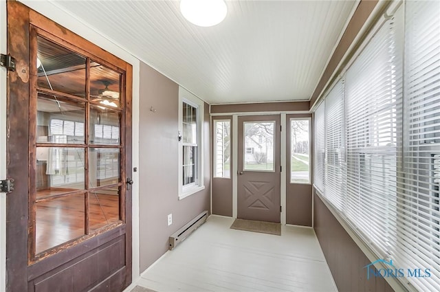 entryway with light hardwood / wood-style floors and a baseboard radiator