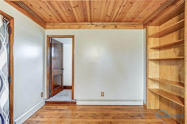 spare room featuring wood ceiling, ornamental molding, and light hardwood / wood-style flooring