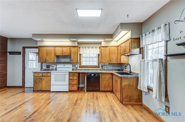 kitchen with dishwasher, white electric range oven, and plenty of natural light