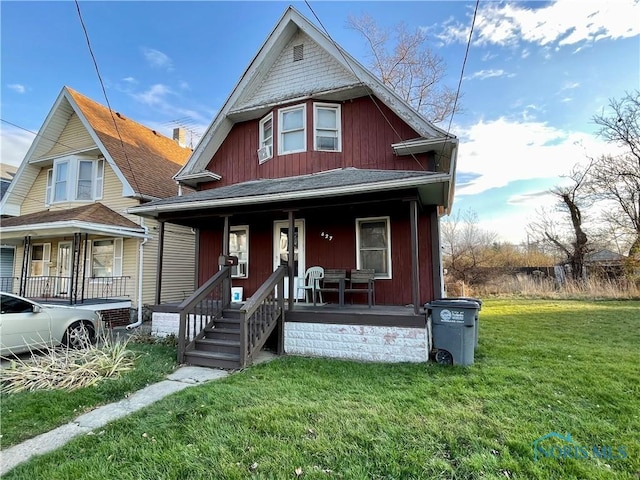 view of front of home featuring a front lawn and covered porch