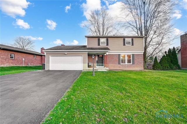 front facade featuring a garage and a front yard