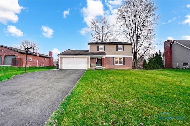 front of property featuring a garage and a front lawn