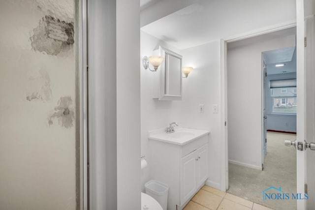 bathroom featuring tile patterned flooring, vanity, and an enclosed shower