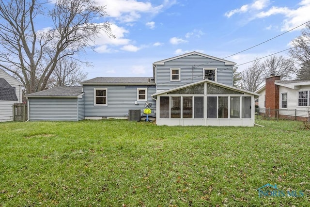 back of property featuring a yard, cooling unit, and a sunroom