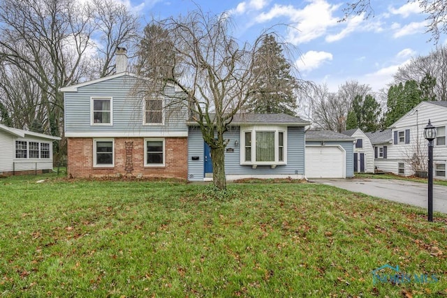 tri-level home with a garage and a front lawn