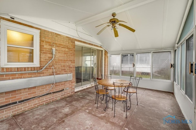 sunroom with vaulted ceiling with beams and ceiling fan