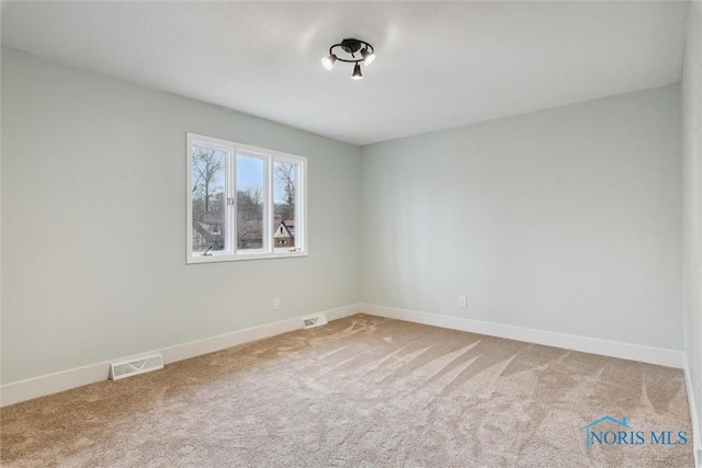 view of carpeted spare room