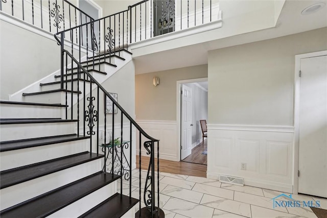 staircase featuring hardwood / wood-style floors