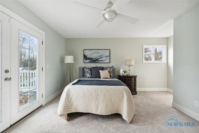 carpeted bedroom featuring ceiling fan and access to outside