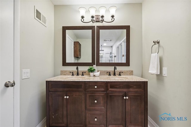 bathroom with a shower and vanity