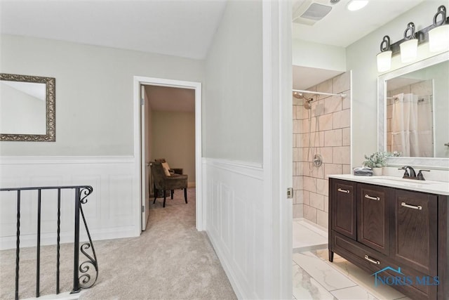 bathroom with a shower with curtain and vanity