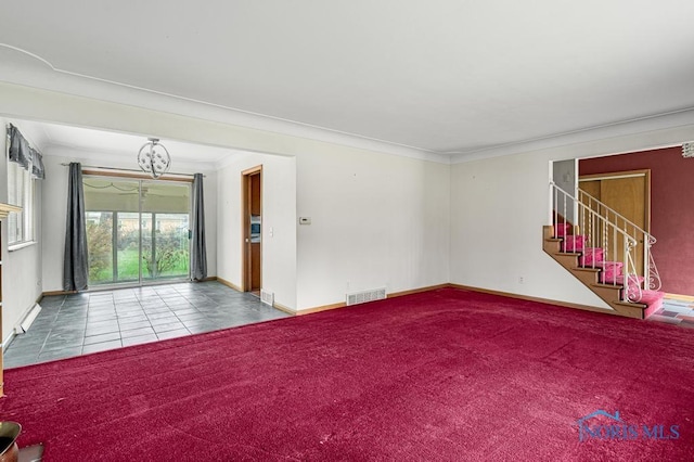 carpeted spare room featuring ornamental molding