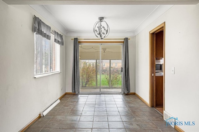 unfurnished dining area featuring crown molding and a baseboard heating unit