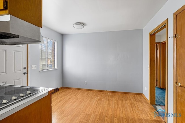 kitchen featuring light wood-type flooring and electric stovetop