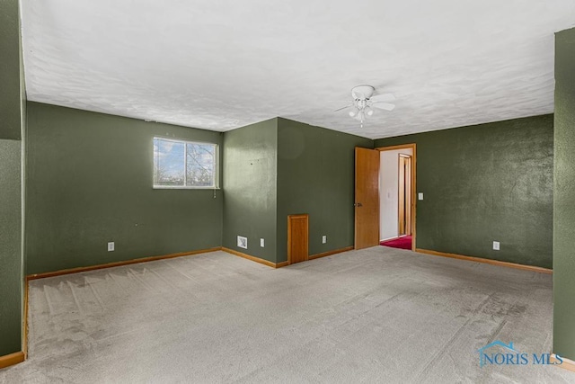 empty room with carpet and ceiling fan