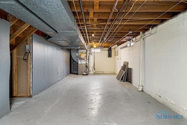 basement with heating unit and water heater