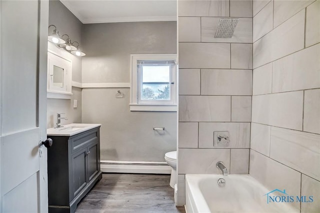 full bathroom with vanity, crown molding, hardwood / wood-style flooring, toilet, and baseboard heating